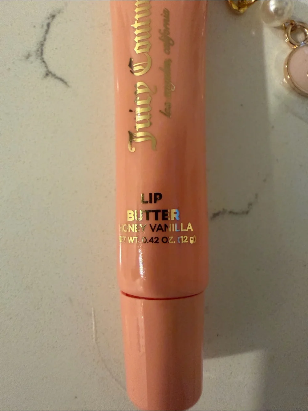 Juicy Couture Peach-Pink Lip Gloss Tube with Gold Heart Charm
